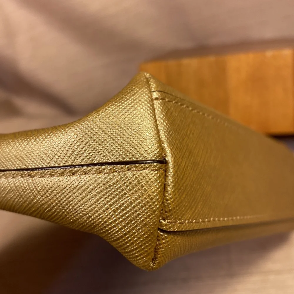 Coach gold metallic color cosmetic pouch w/elegant bow